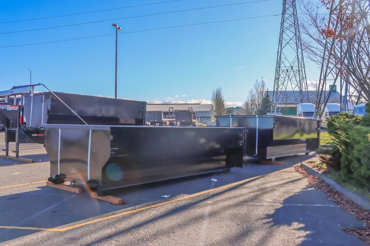 Roll-off dumpster ready for waste disposal at job site for 6 Yard Dumpster Rental in Smiths Station